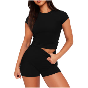 Woman wearing a black outfit on a white background